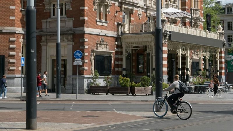 woman riding a bicycle in Amsterdam, Netherlands